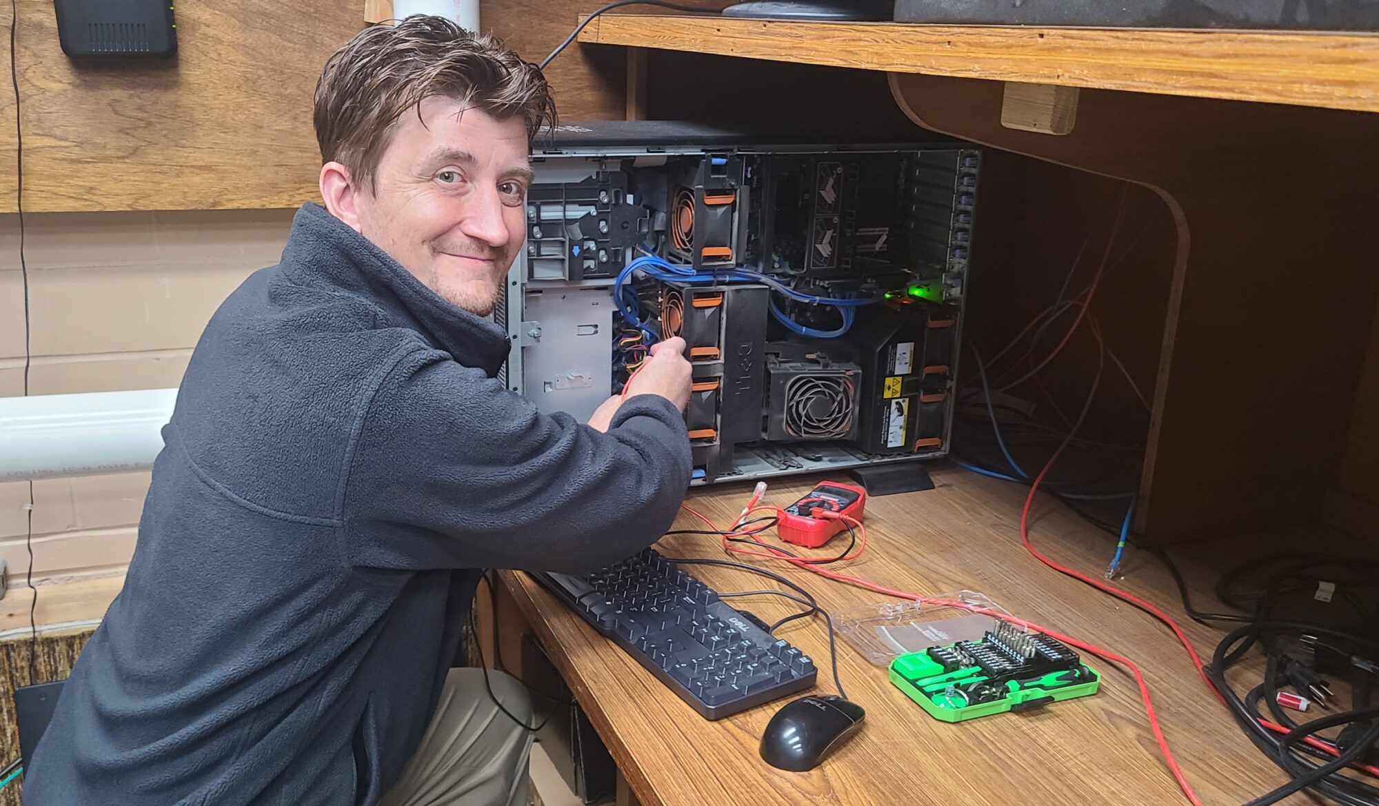 Jon working inside an open server tower in Oil City, Venango County, PA